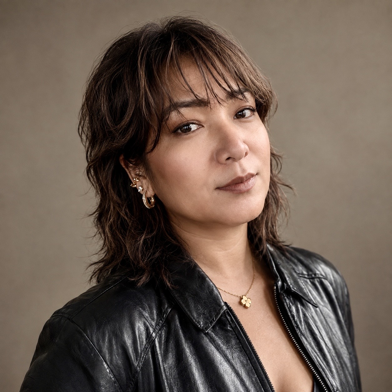 Kit Nicolas in a black leather jacket
